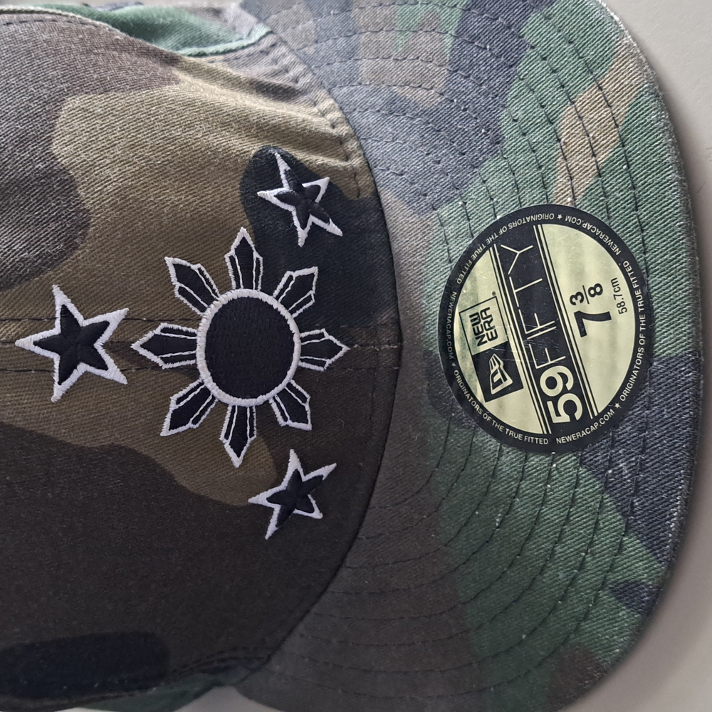 New Era Green and Brown Camouflage Hat with Embroidered Design